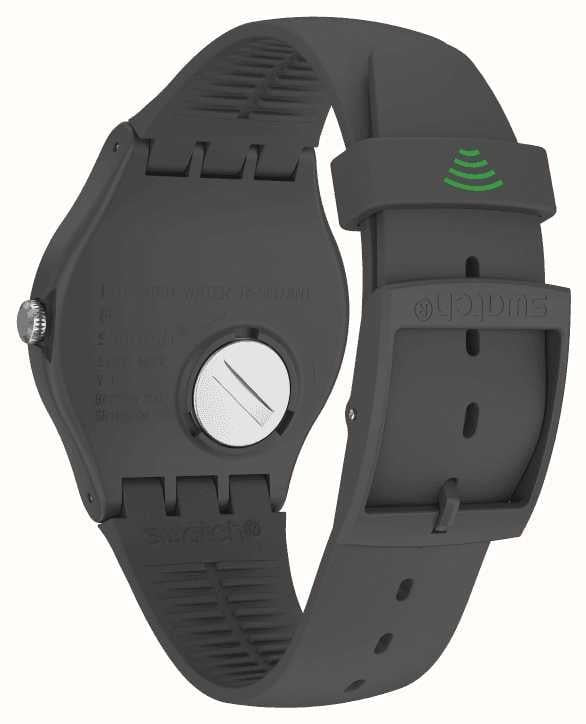 Close-up of black silicone watch bands and clasp with green wireless indicator mark
