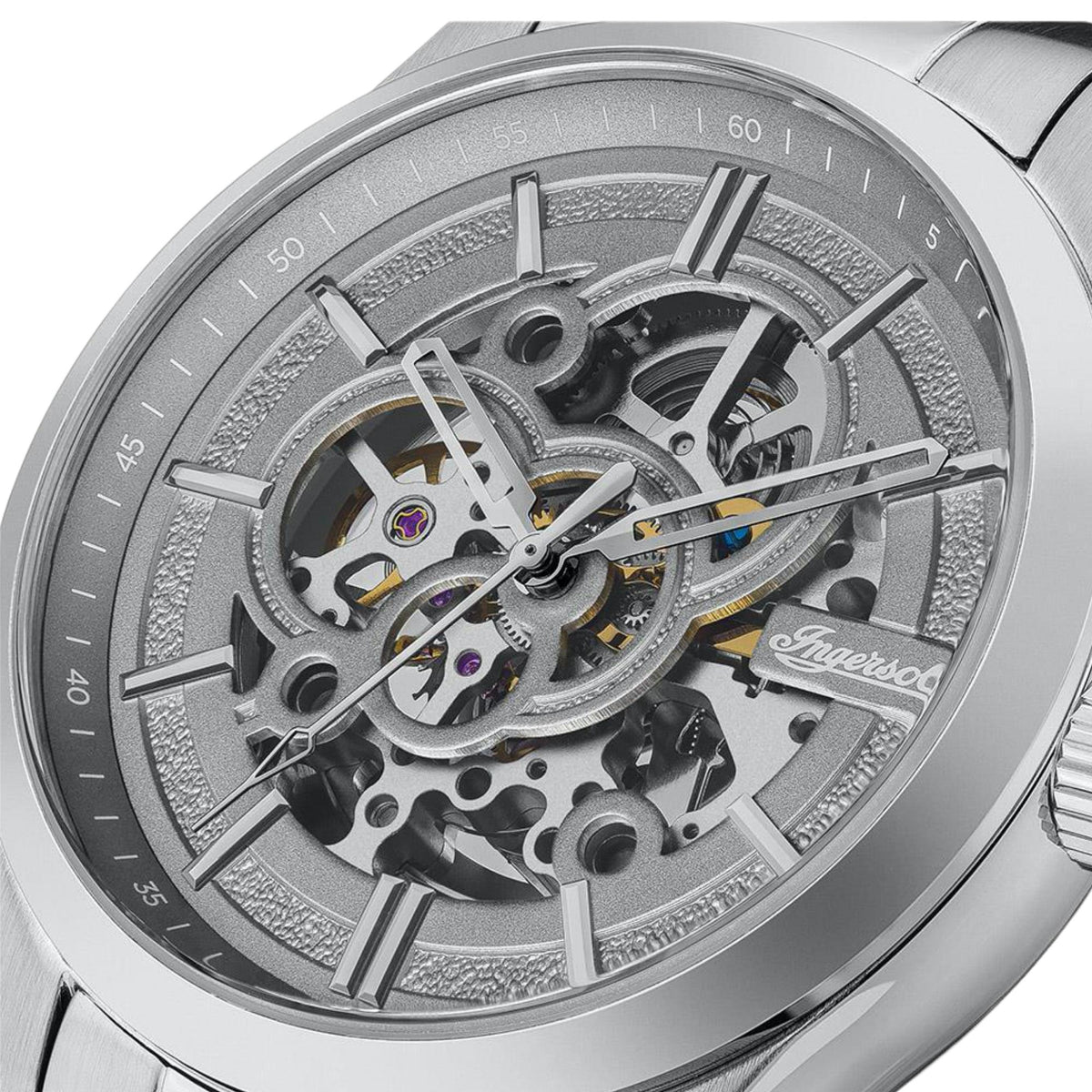 Stainless steel watch case back close-up showing skeleton movement and grey dial ring