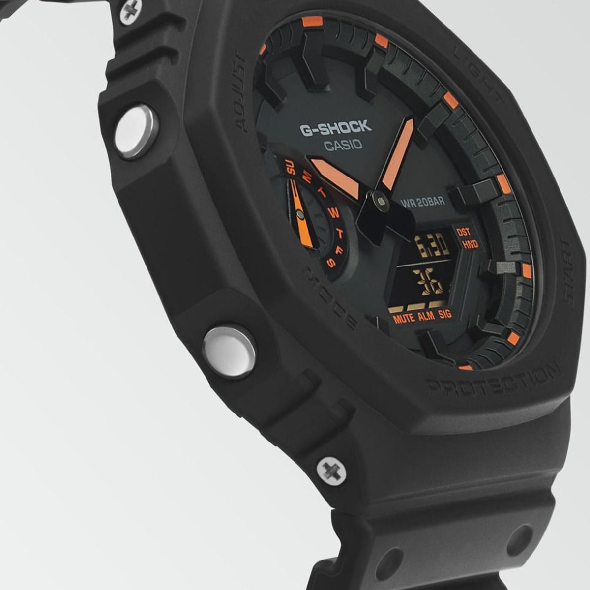 Close-up of men's dark grey octagon watch dial with orange accents and molded bezel