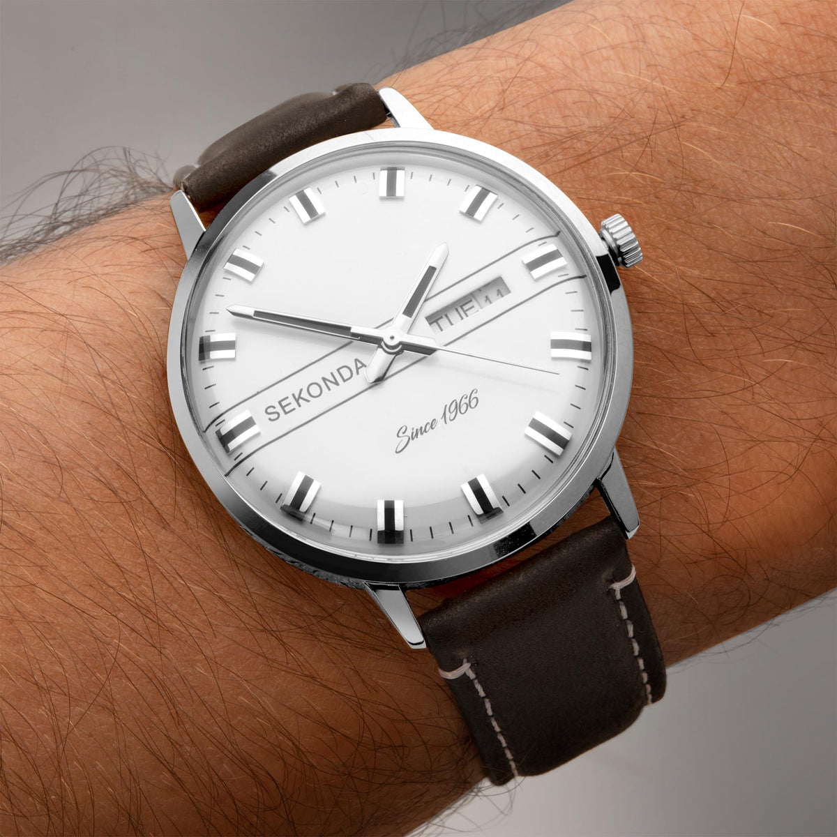 Sekonda men's watch on wrist with white dial, black leather strap, silver bezel.