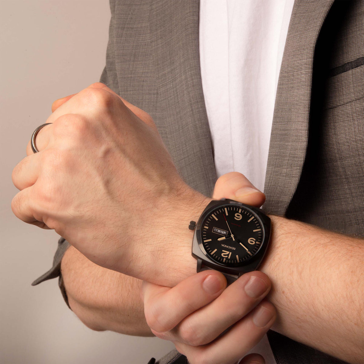 Men's Sekonda quartz watch on wrist with black dial and black strap