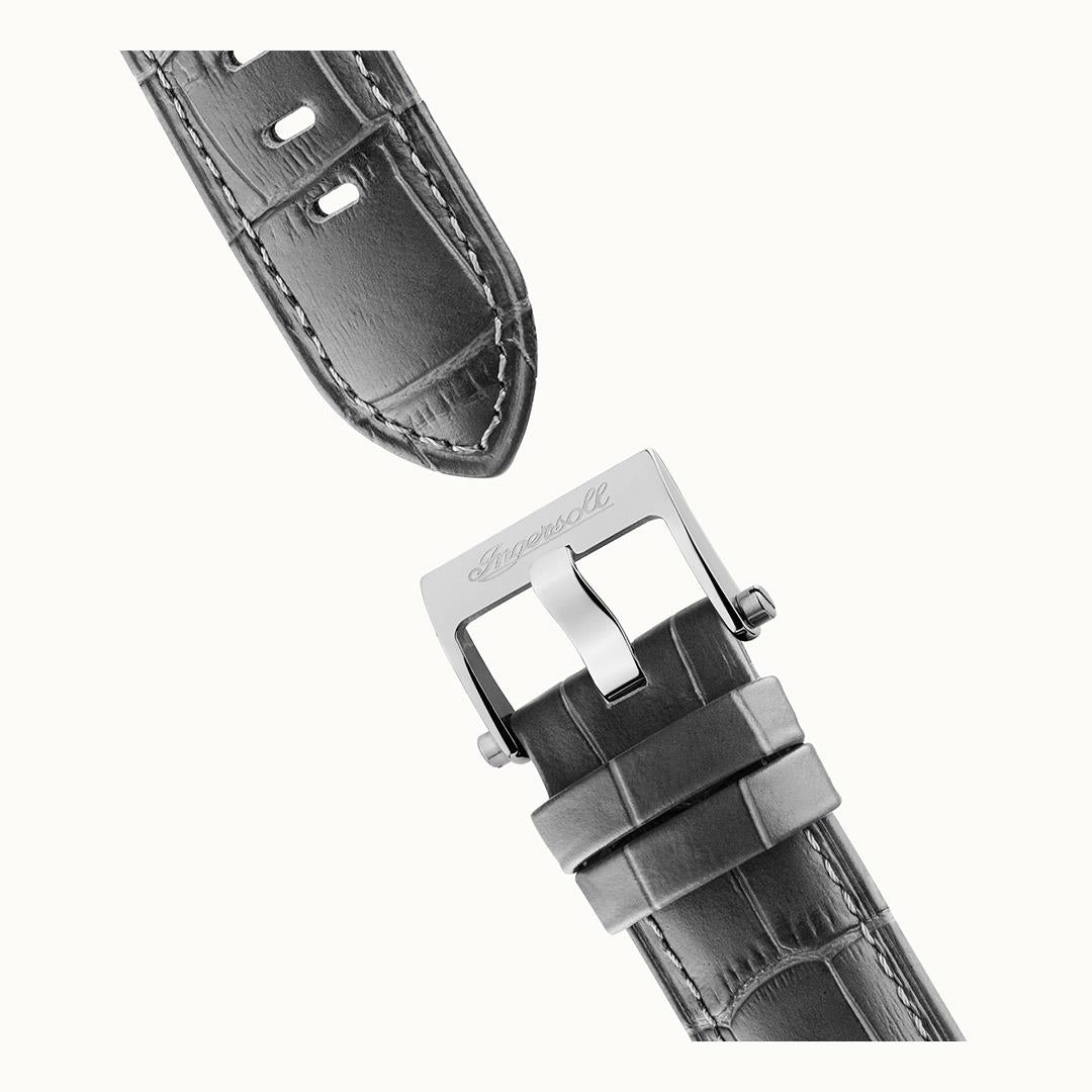 Men's automatic leather strap watch with silver clasp; black strap close-up