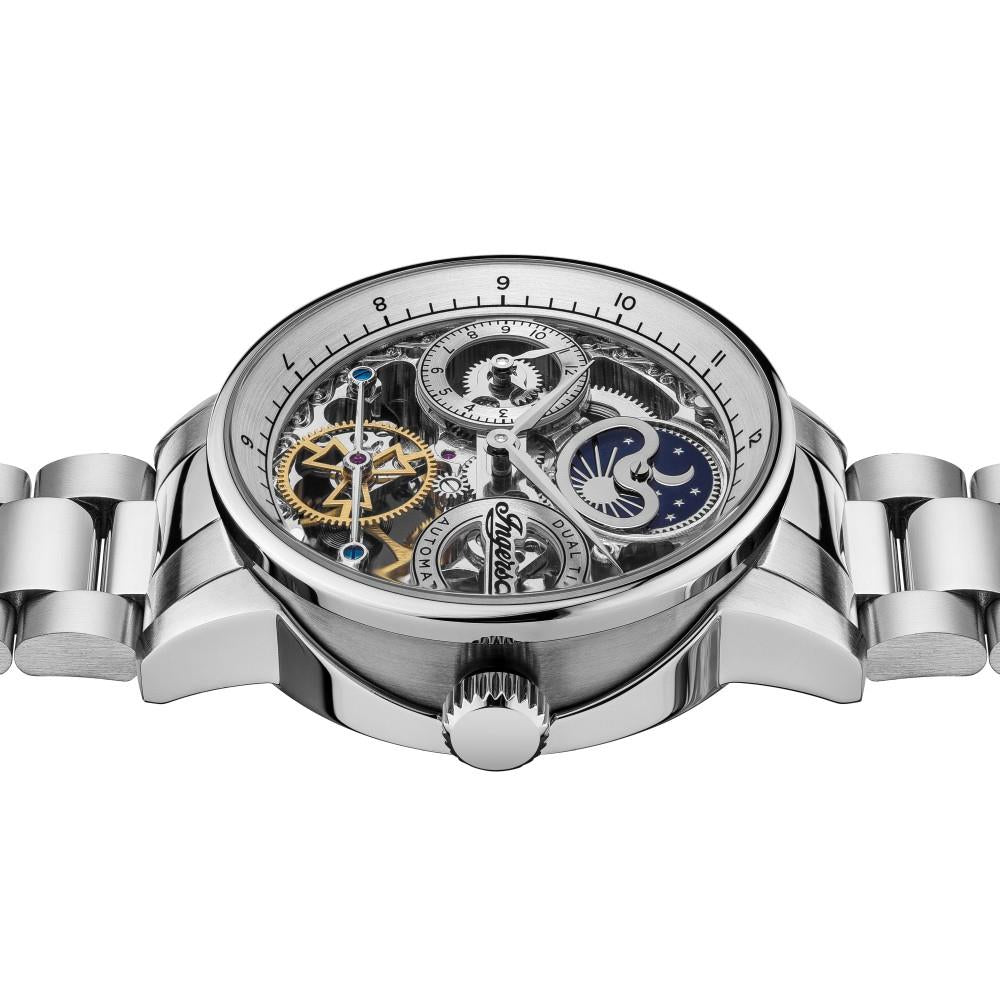 Top view of silver automatic watch with skeleton dial, gears, and star accents