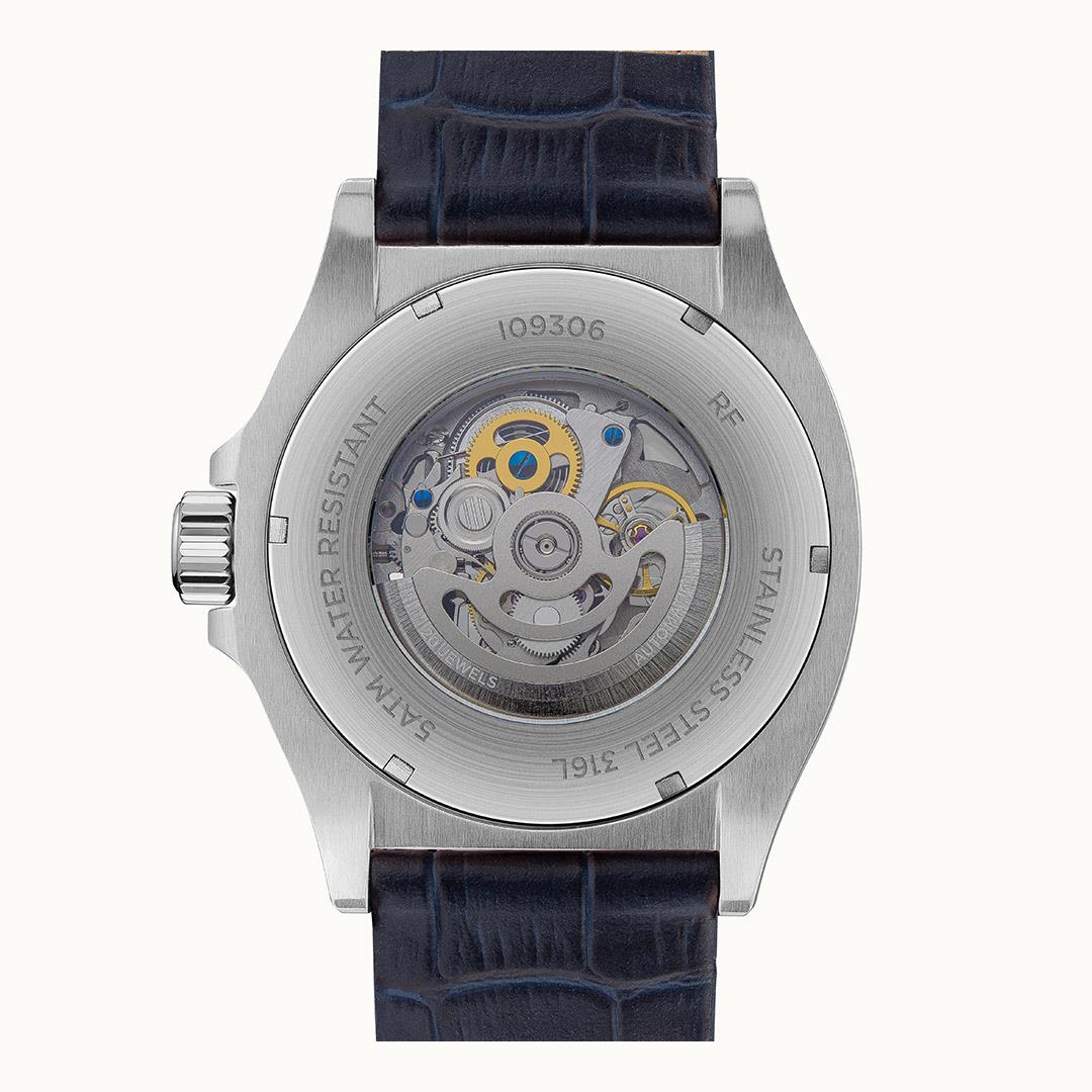 Men's automatic watch caseback featuring visible gears and navy leather strap, round steel case.