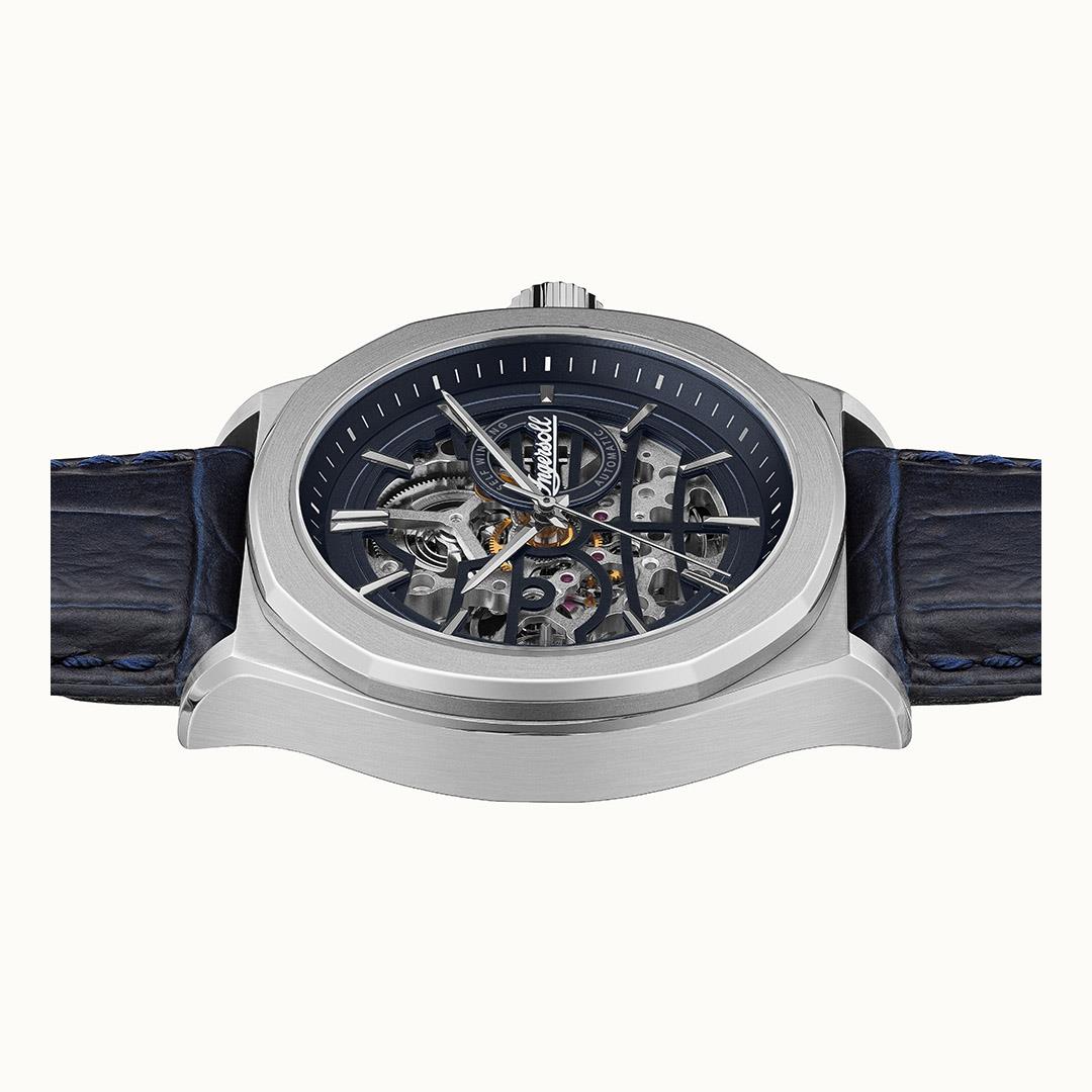 Automatic skeleton wristwatch with navy dial, exposed gears, stainless case, blue leather strap