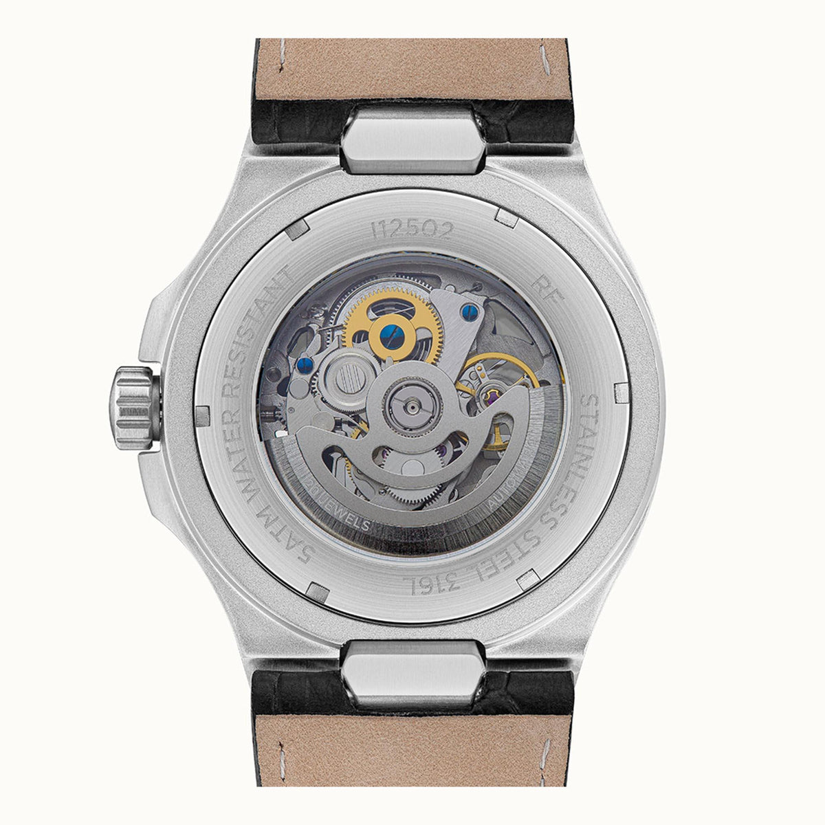 Men's automatic skeleton watch case close-up showing inner gears and black leather strap