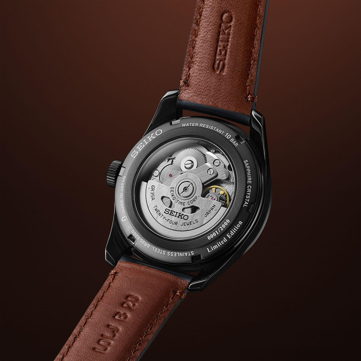 Seiko Presage men’s watch caseback on brown leather strap, showing engraved outer ring.