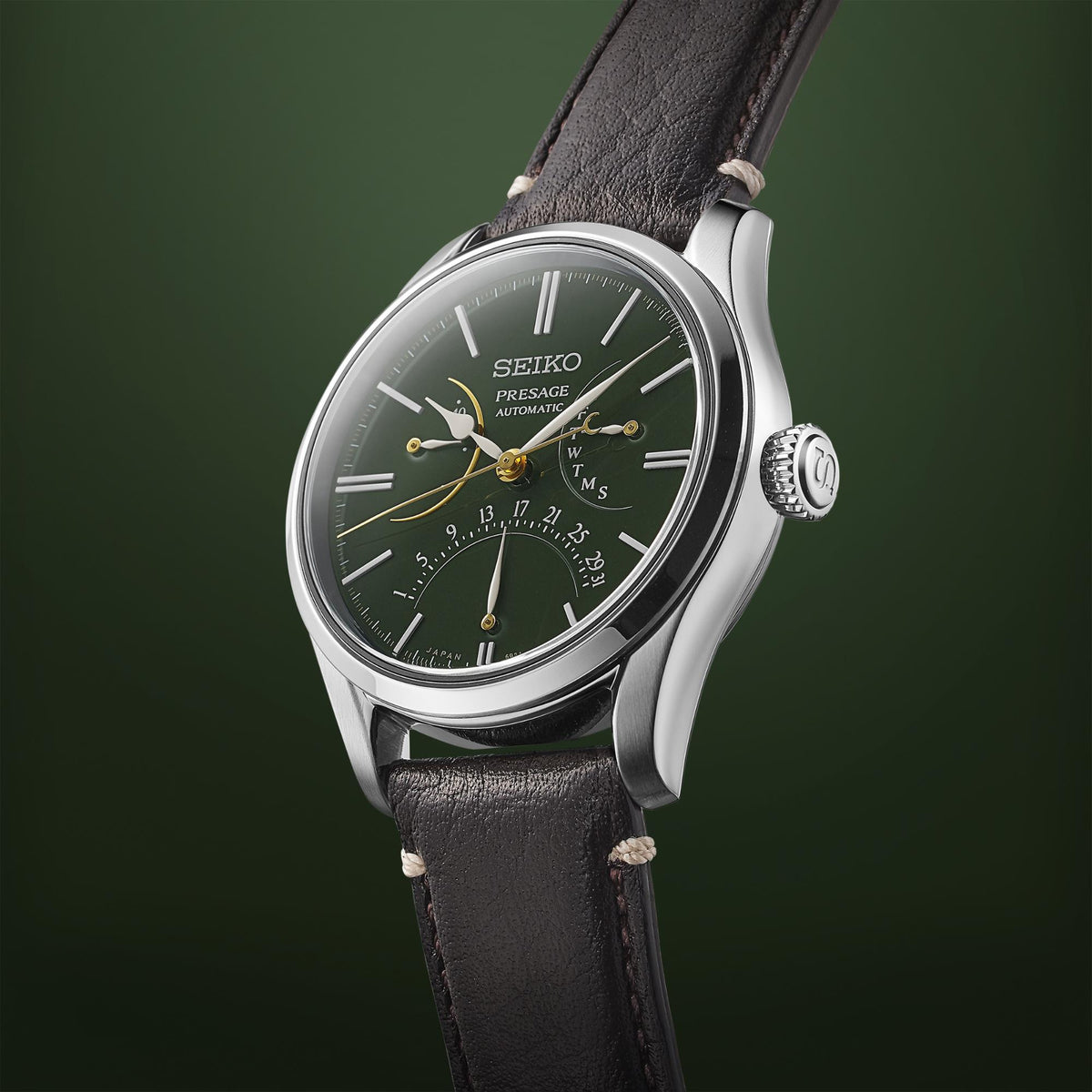 Men's automatic watch right-side profile with green dial, silver case, and black leather strap