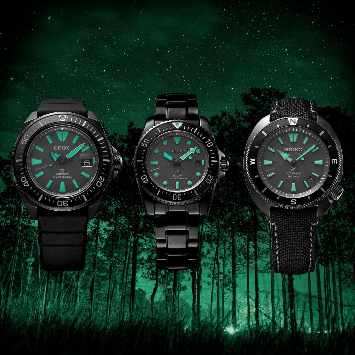 Three black solar dive watches with green dials and black bracelets