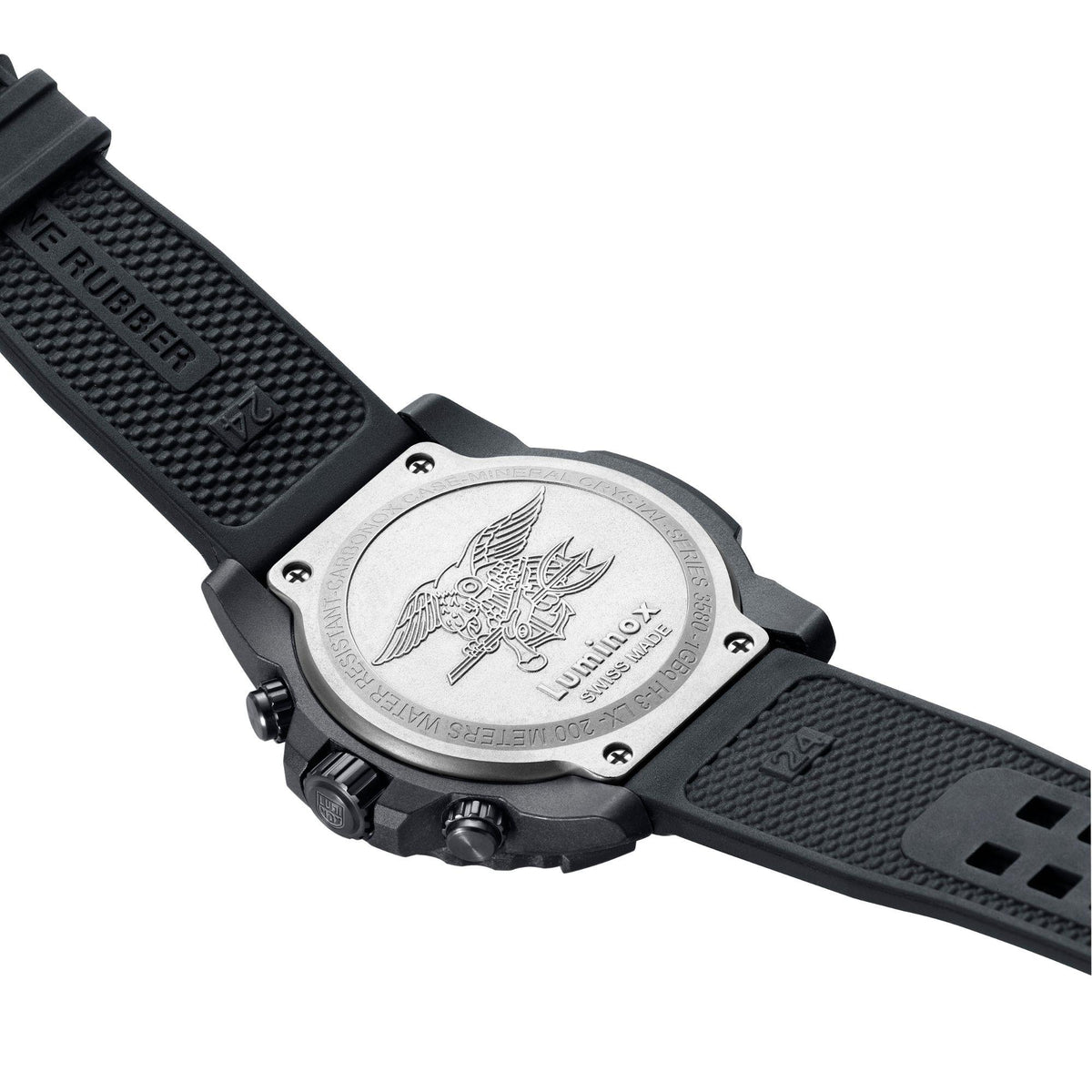 Watch caseback with engraved emblem on black rubber strap