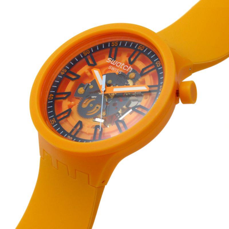 Orange Swatch skeleton dial watch angled close-up with orange bezel and black markers