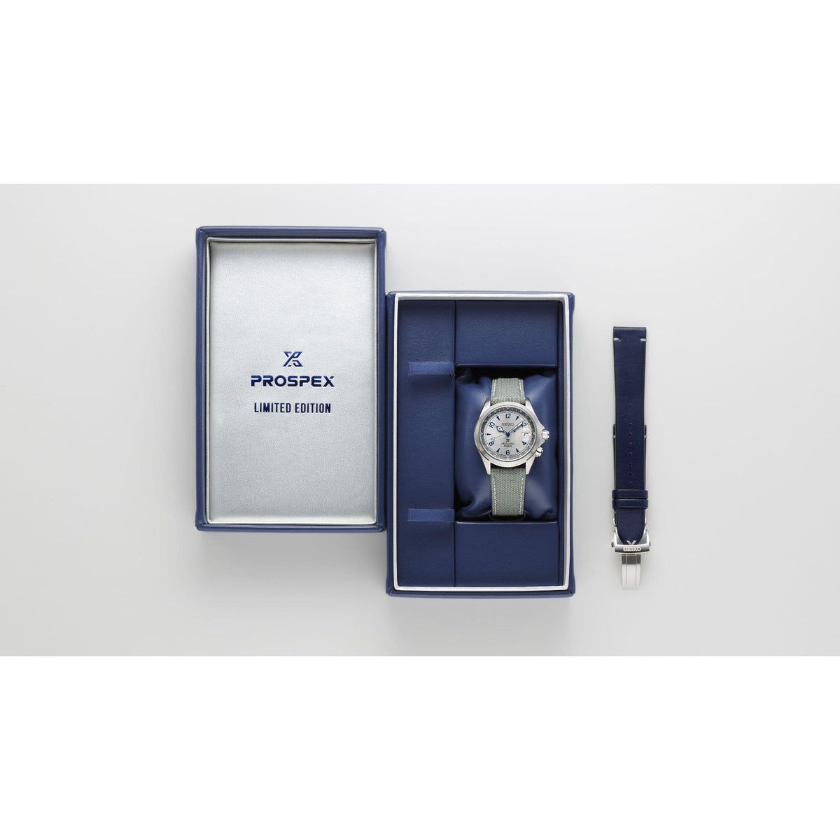 Men's stainless steel watch in blue presentation box with matching strap