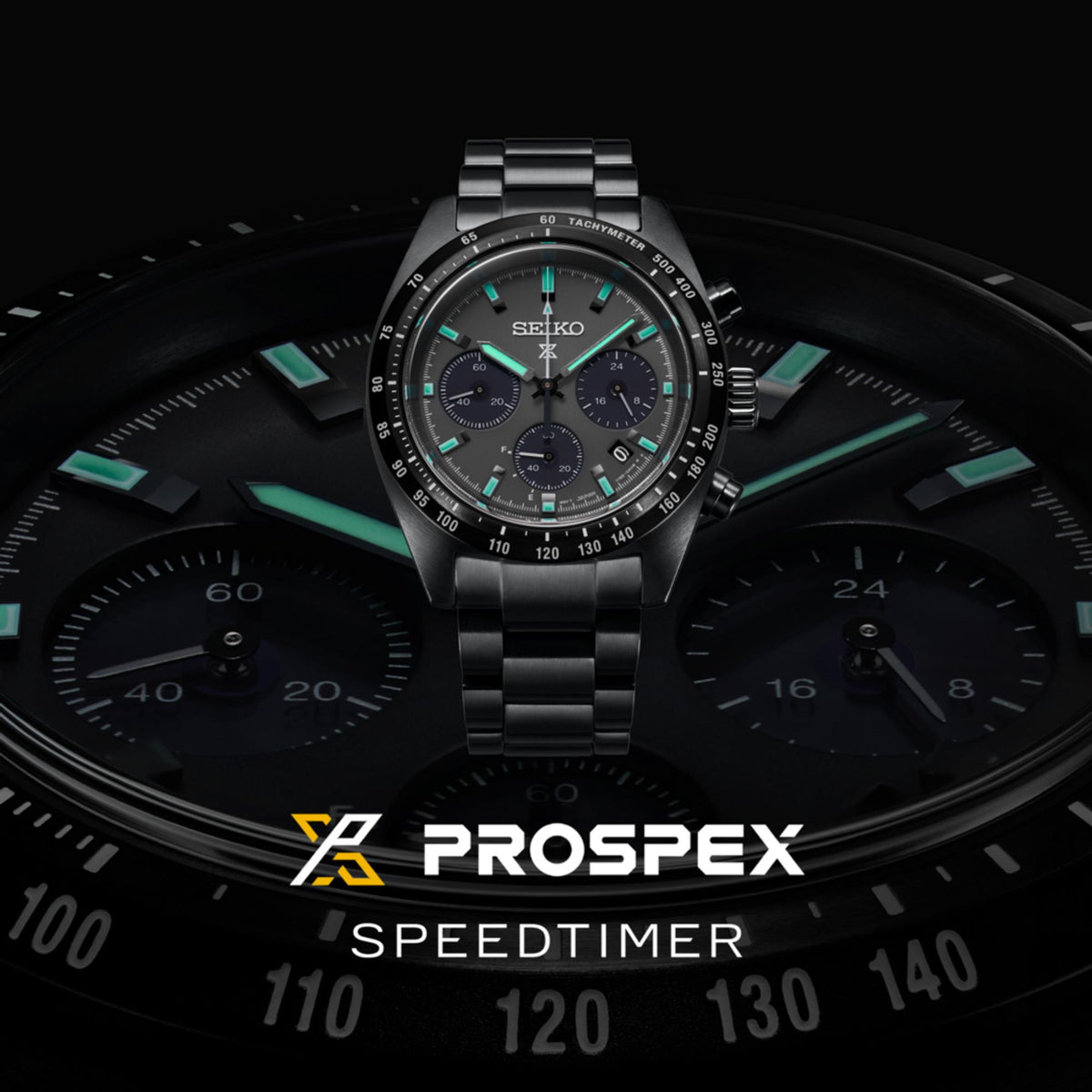 Black tachymeter chronograph watch with turquoise markers, steel bracelet