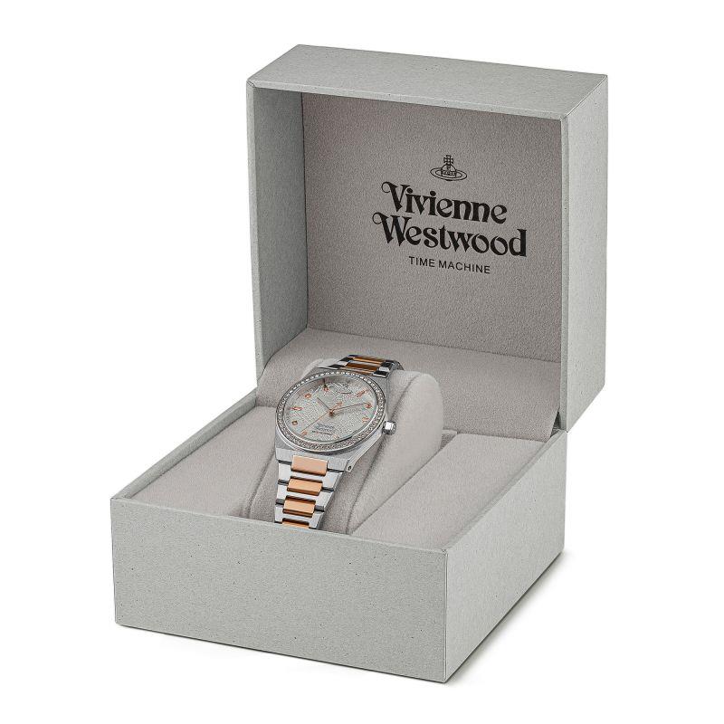 Ladies bracelet watch with silver-tone case, orange-gold links, patterned dial
