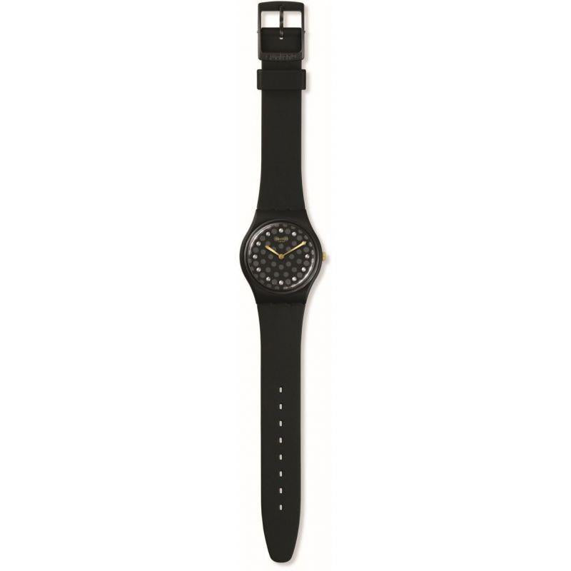 Black Swatch watch with dotted dial and black rubber strap, top buckle visible.