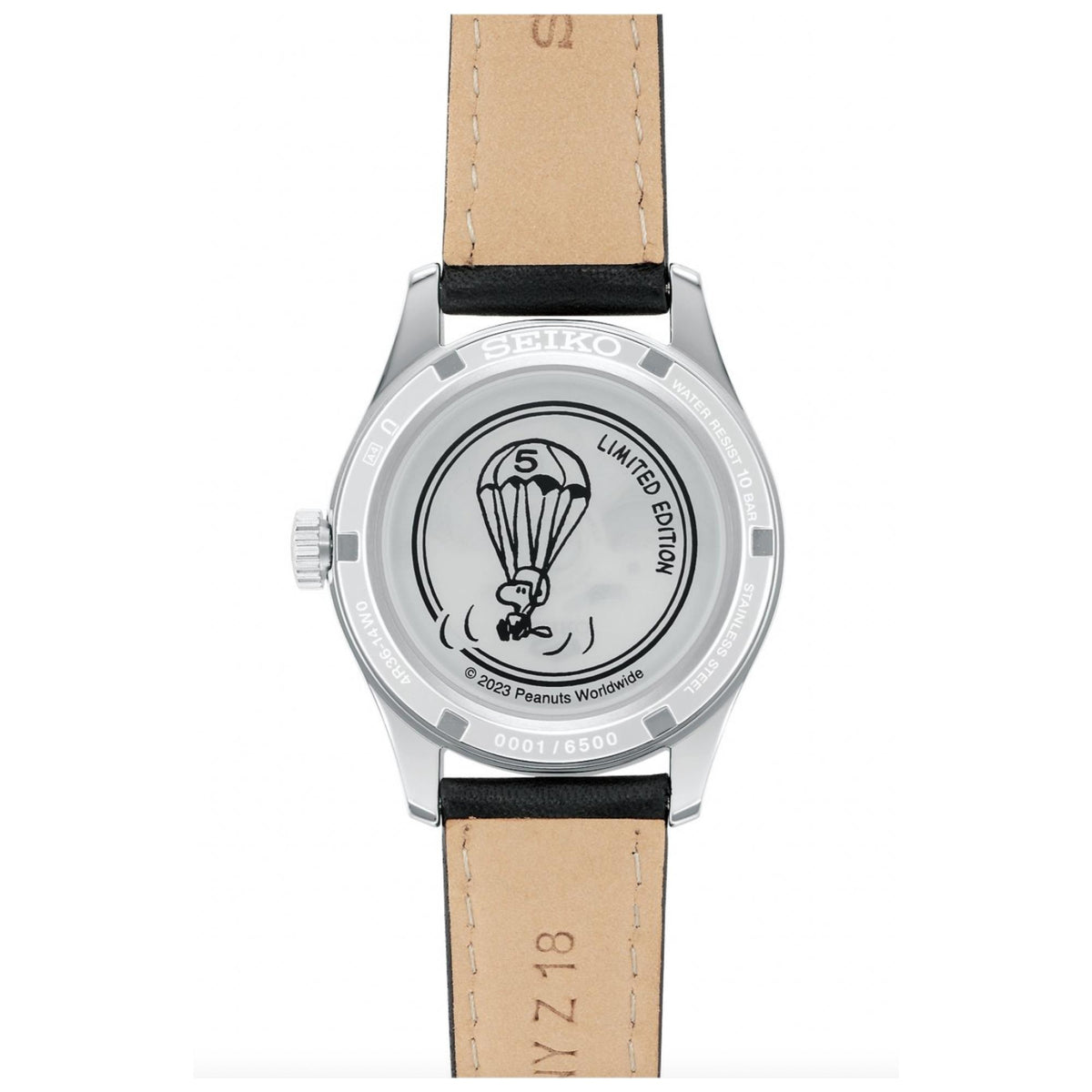 Automatic watch caseback with parachute emblem; tan leather strap and steel case