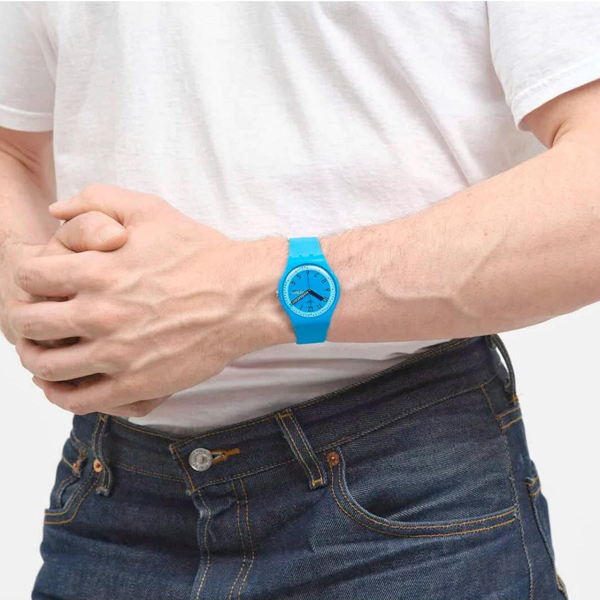 Blue quartz wristwatch with round face and blue dial on a silicone strap