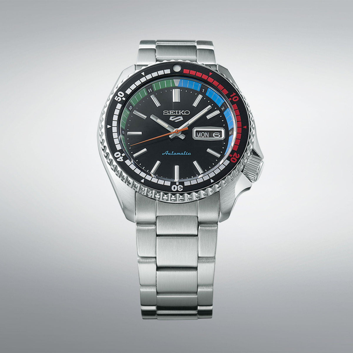Seiko men's automatic diver watch, front view, black dial with multicolor bezel and markers