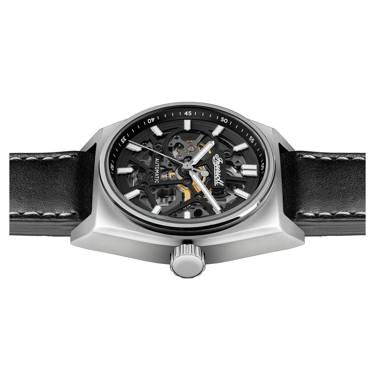 Automatic skeleton watch side view on black leather strap, silver crown button
