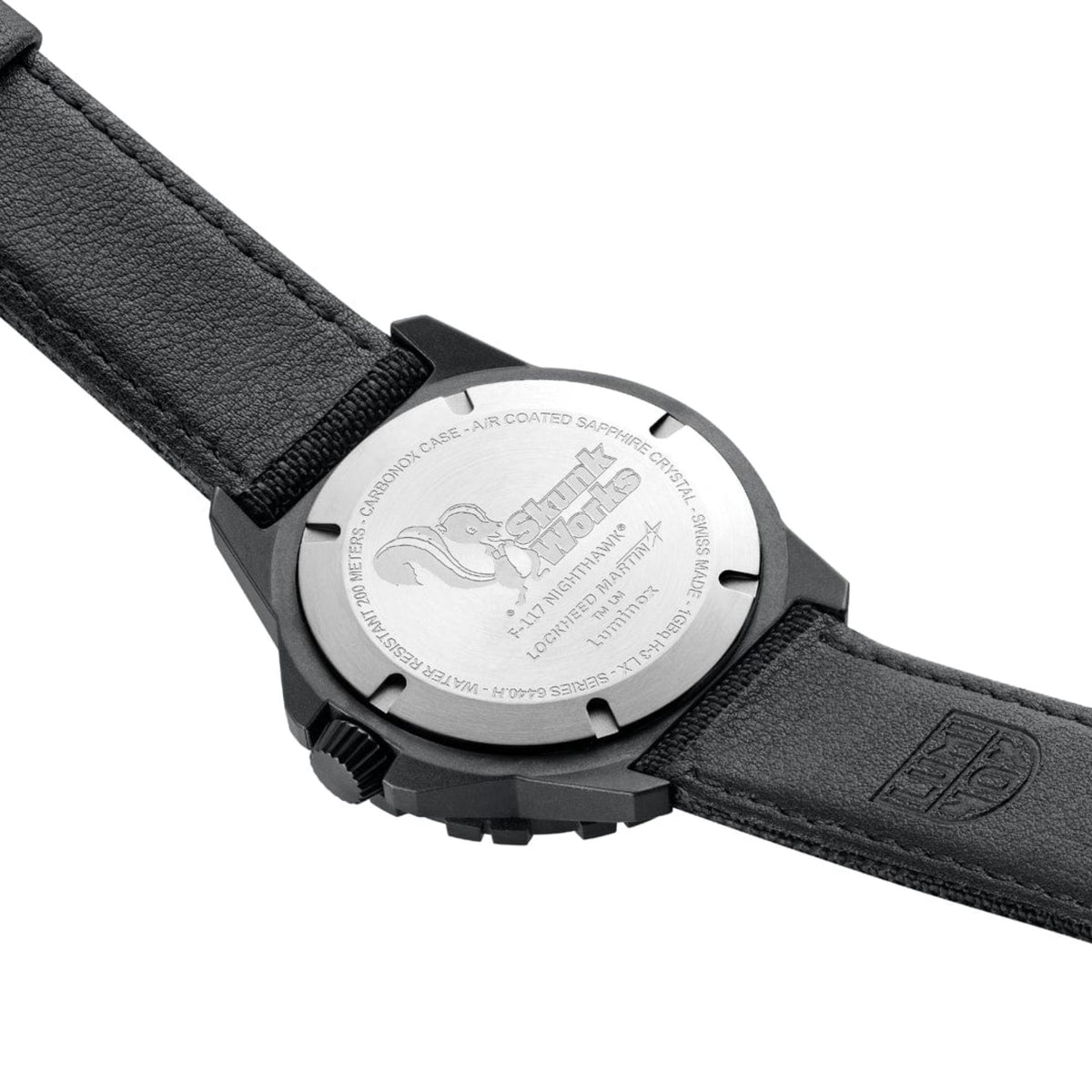 Men's black quartz watch caseback with engraved markings and black fabric strap