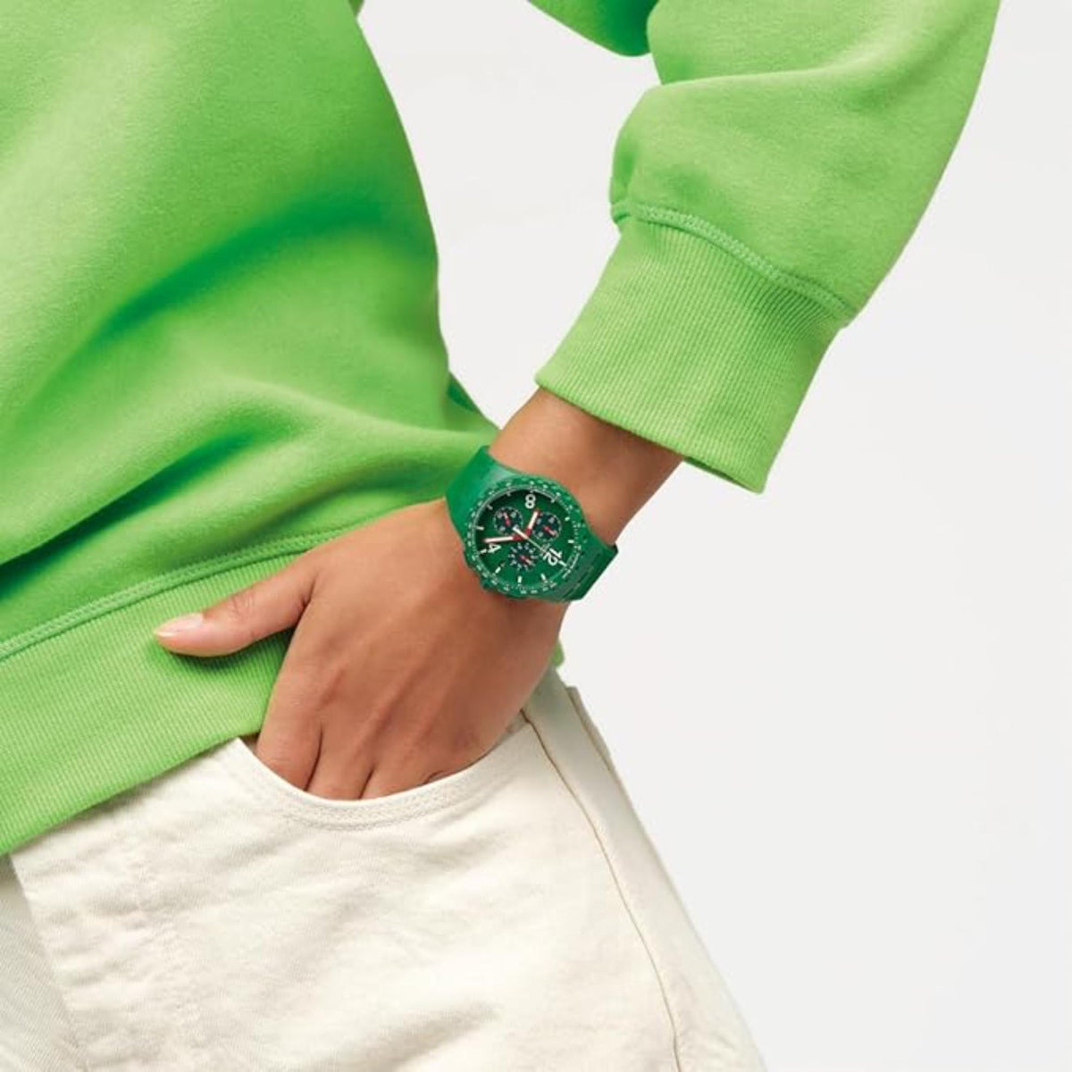 Green chronograph men's watch on wrist, green dial with subdials and strap