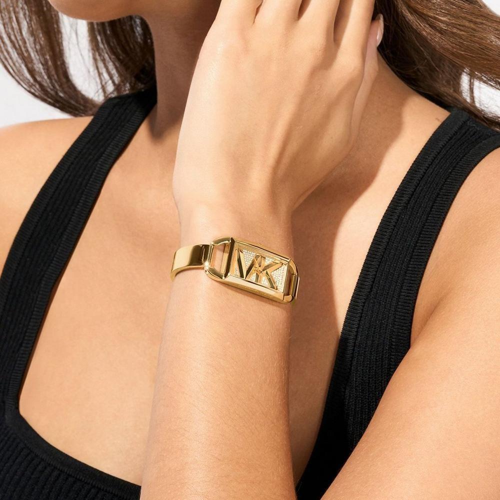Gold-tone rectangular watch on wrist with sparkling geometric dial and slim band