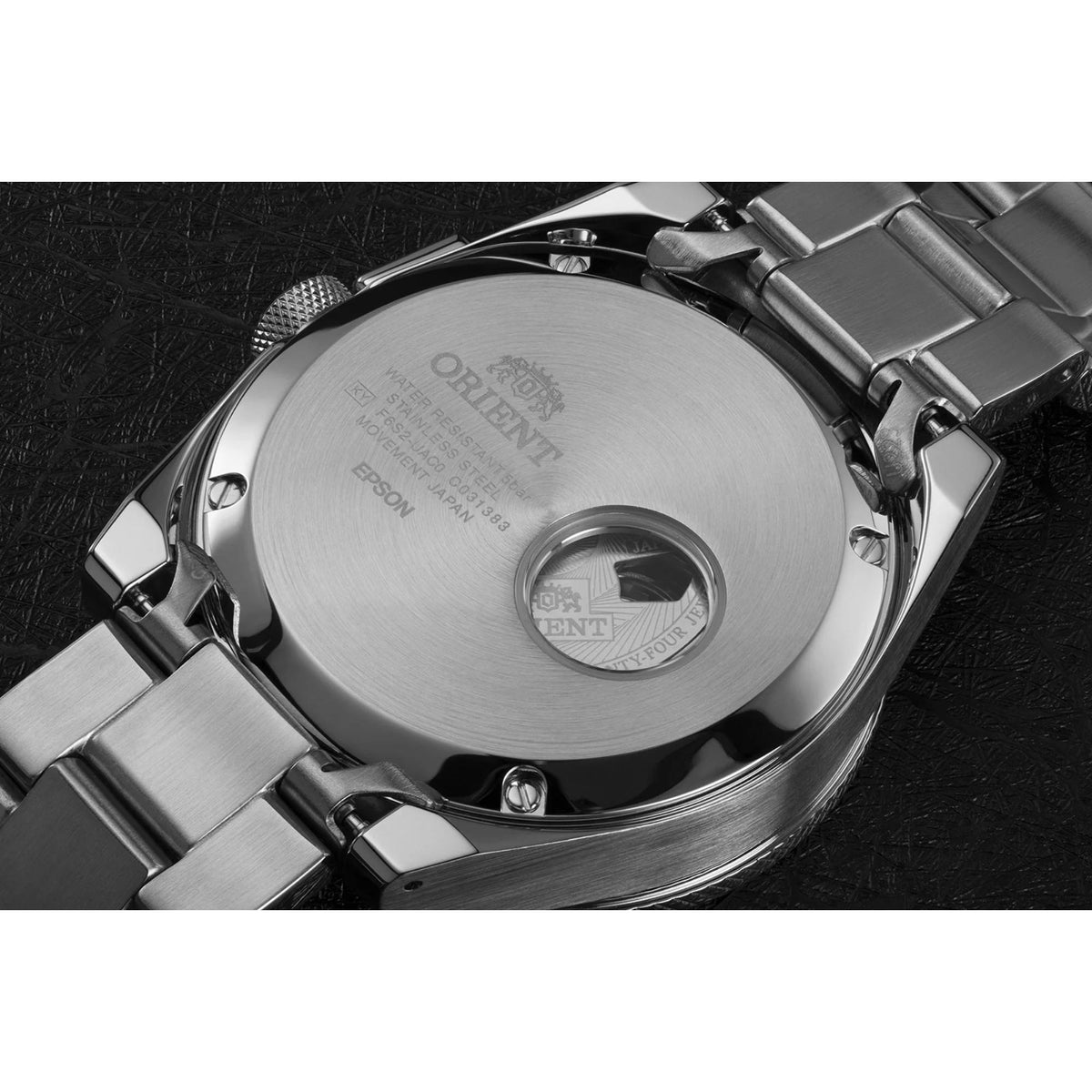 Men's steel automatic wristwatch, angled view showing black open-heart dial and bezel