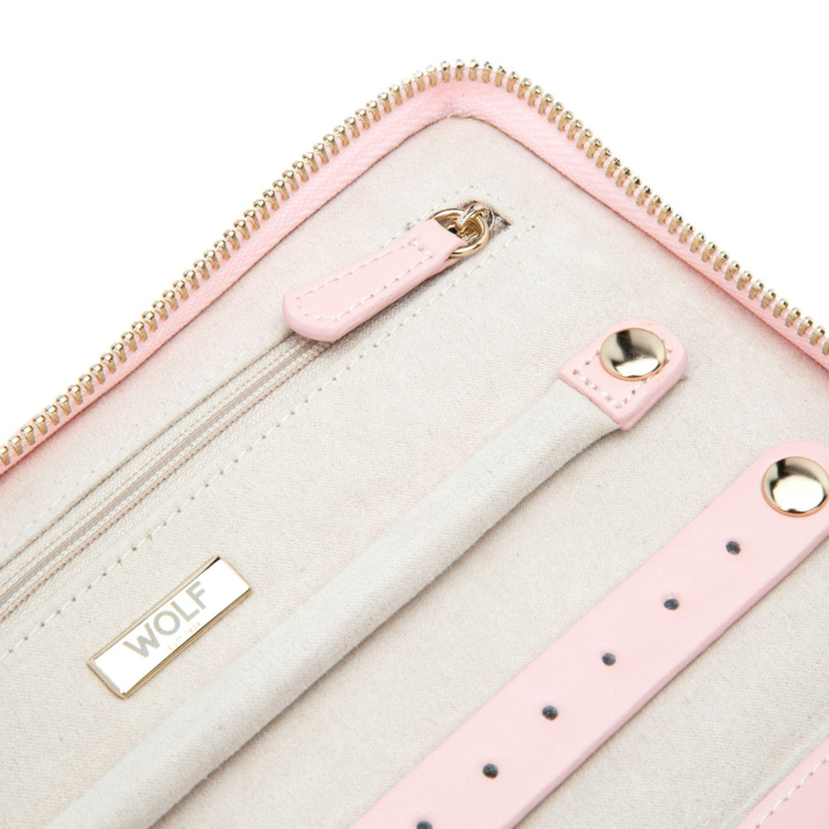 Light pink jewelry portfolio interior close-up with WOLF logo and pink strap details