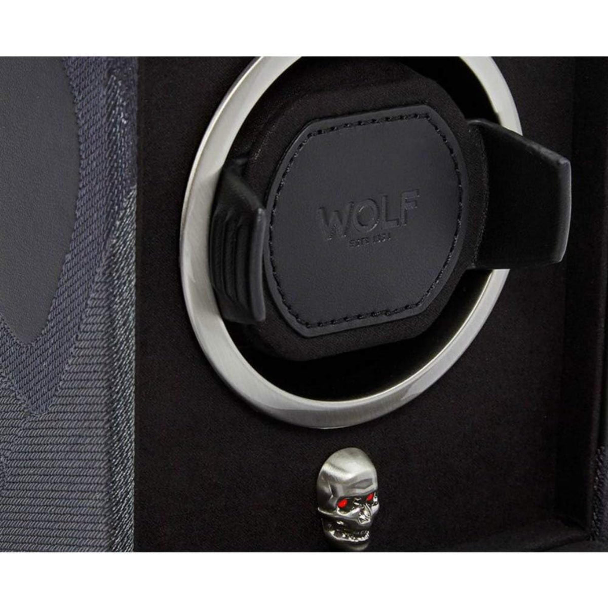 Single watch winder rotor close-up with silver ring, embossed WOLF pad, and skull charm