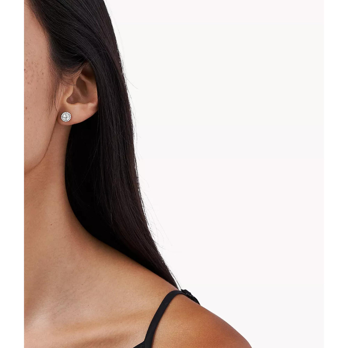 Sterling silver halo CZ stud earring displayed on side profile ear
