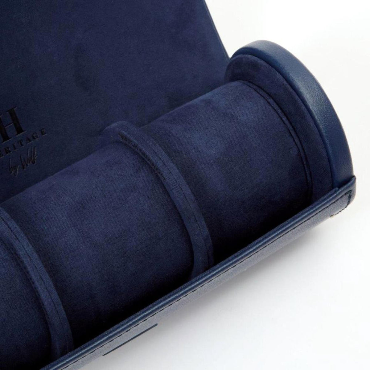 Detail of navy leather watch roll padding and end cap