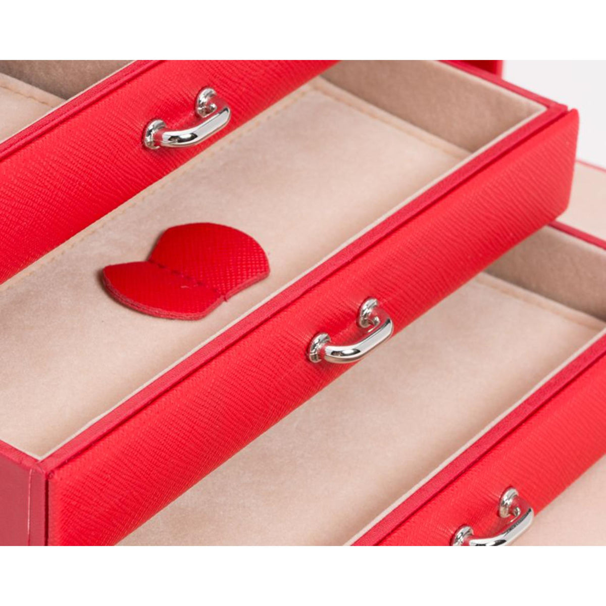 WOLF Heritage leather jewelry box closeup: red textured lids with heart-shaped insert