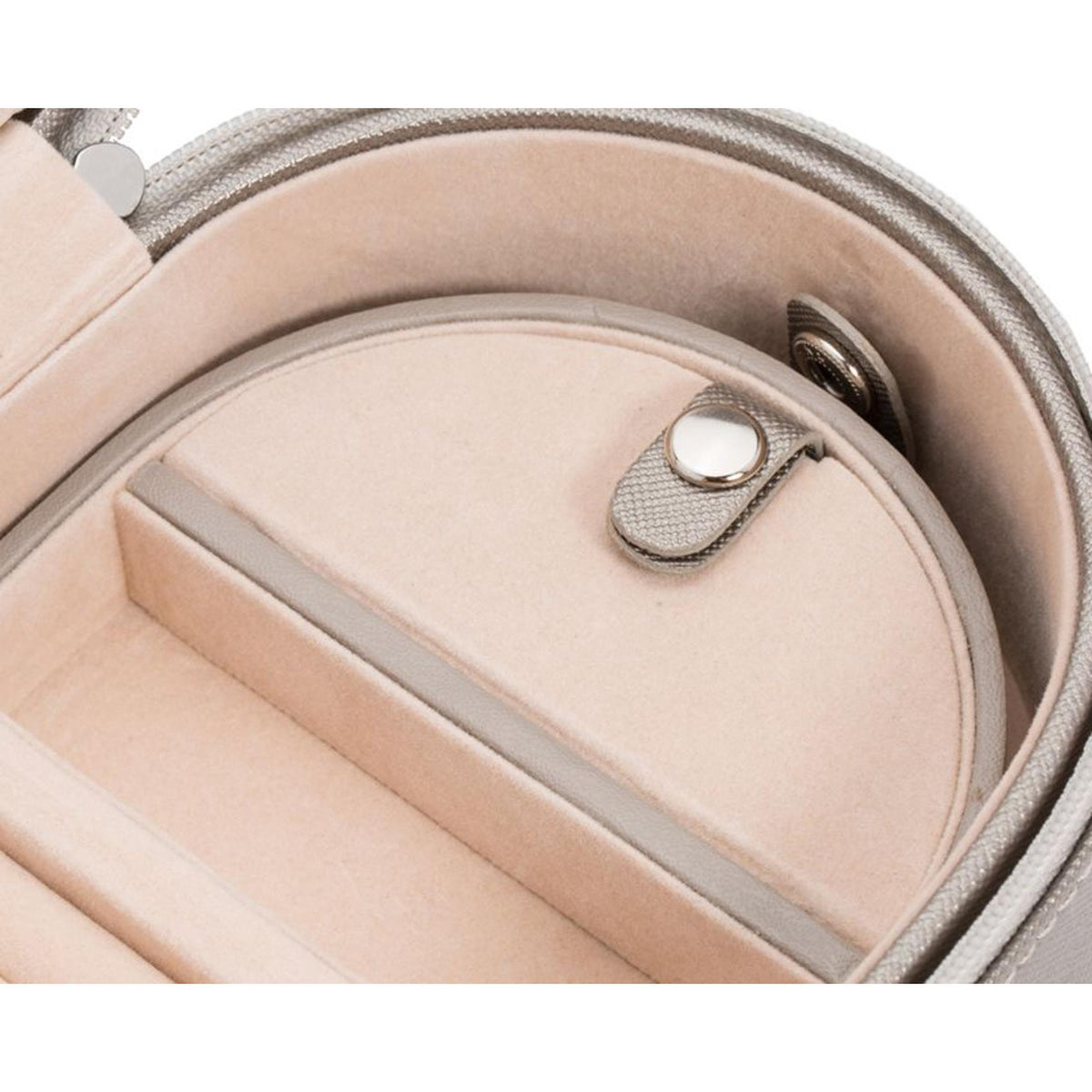 Tan leather case interior close-up with stitched divider and metal ring clasp