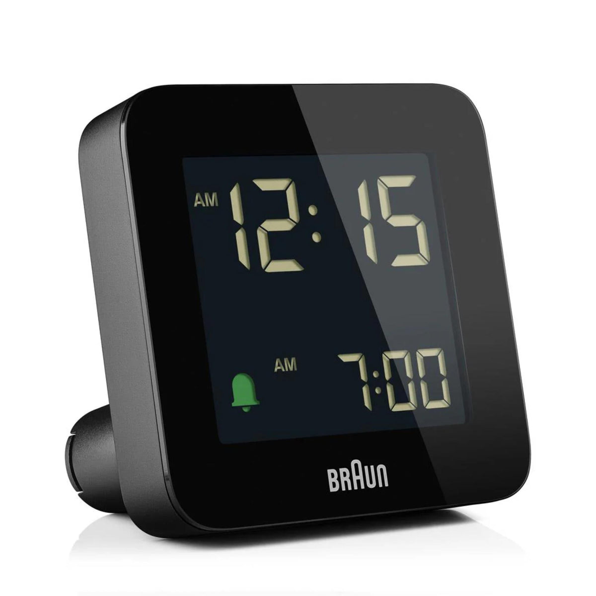 Black digital alarm clock with blue backlit screen showing 12:15 and 7:00 AM