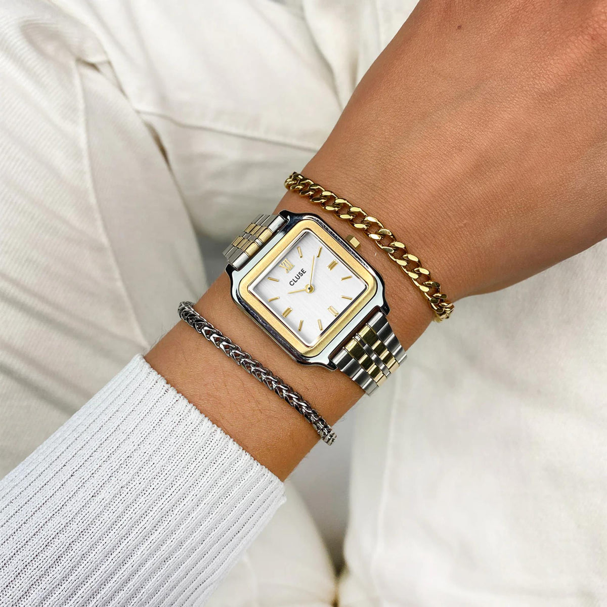 Women's rectangular quartz watch with white dial and gold-tone metal link strap