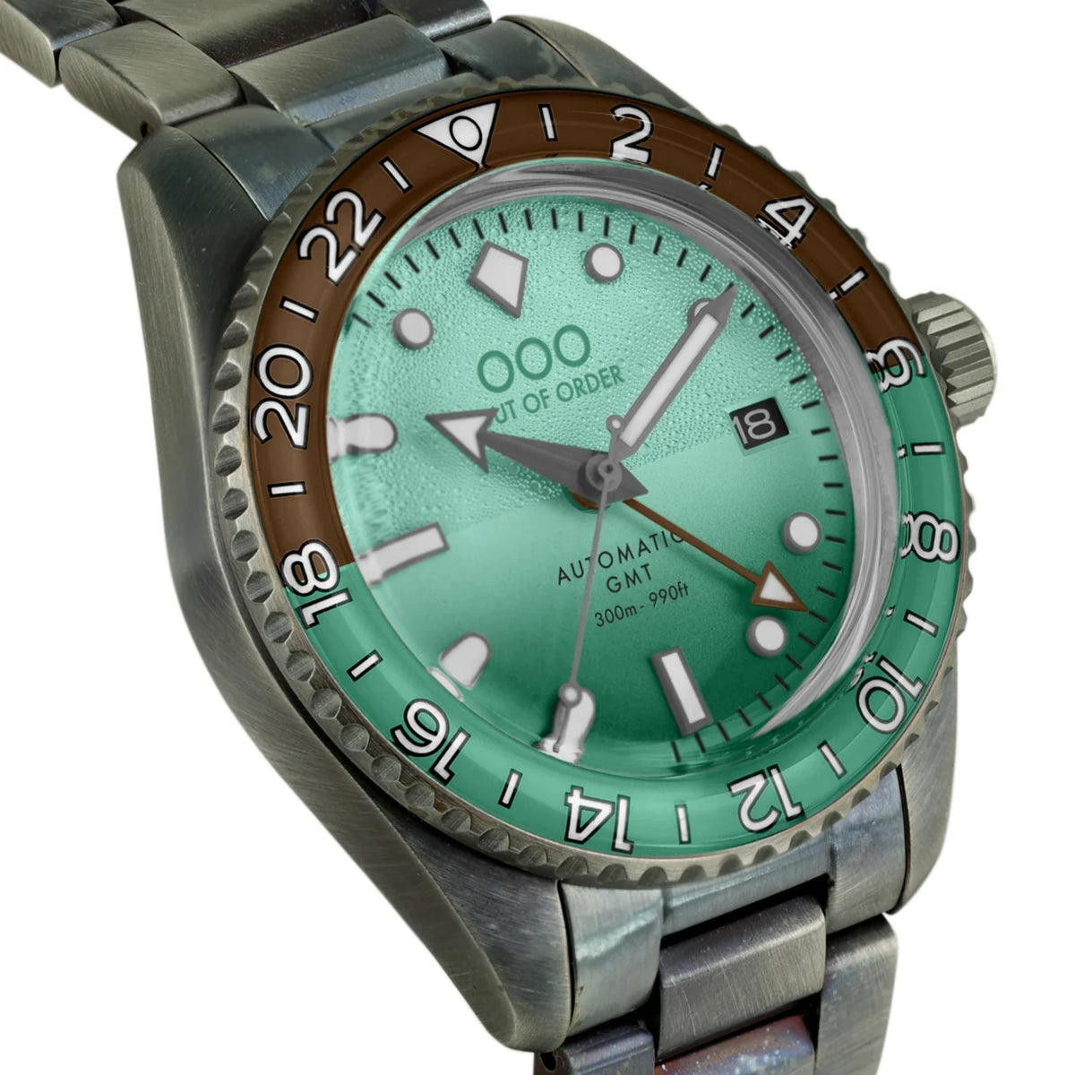 Men's automatic GMT watch angled view with mint-green dial and silver steel bracelet