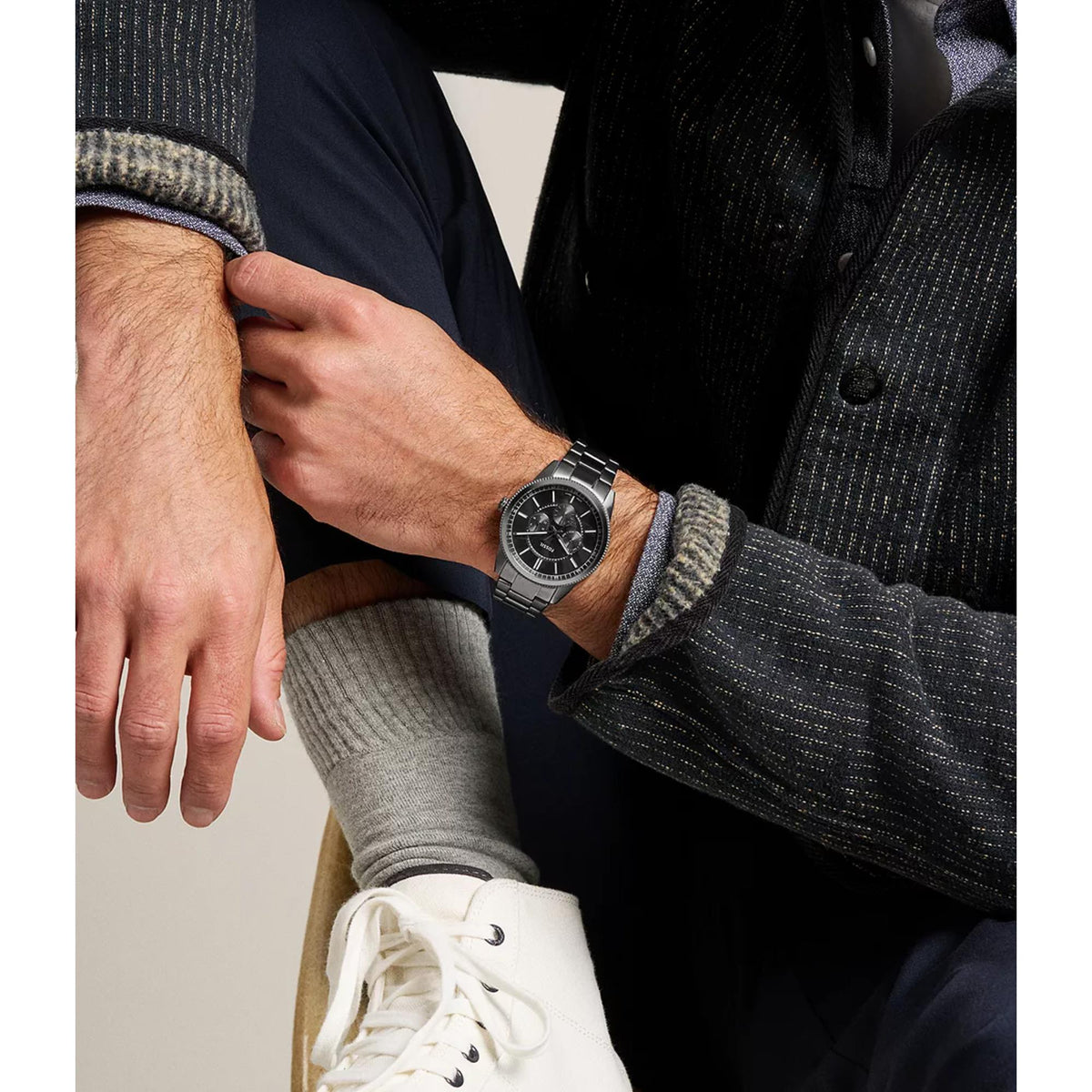 On-wrist studio shot of the Fossil Pearson FS6136 mens watch displaying the black dial and dark steel case