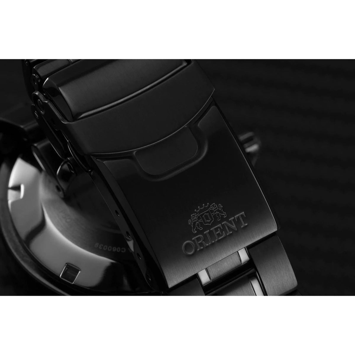 Men's automatic diver watch clasp and caseback detail with black steel links