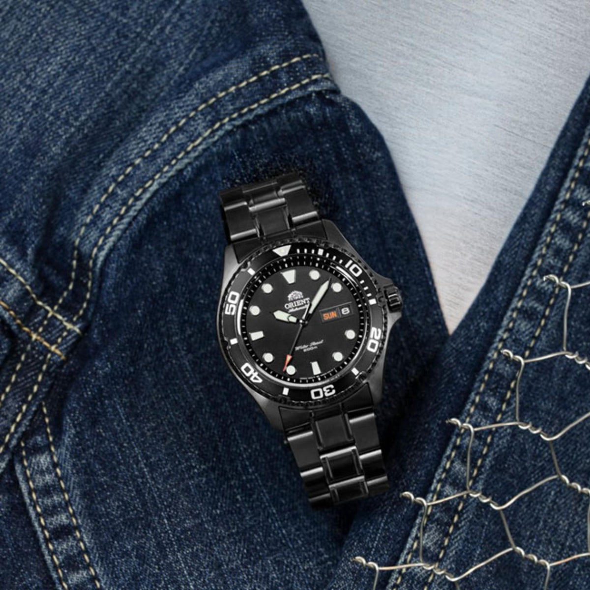 Men's automatic diver watch on denim fabric, black dial and black steel bracelet