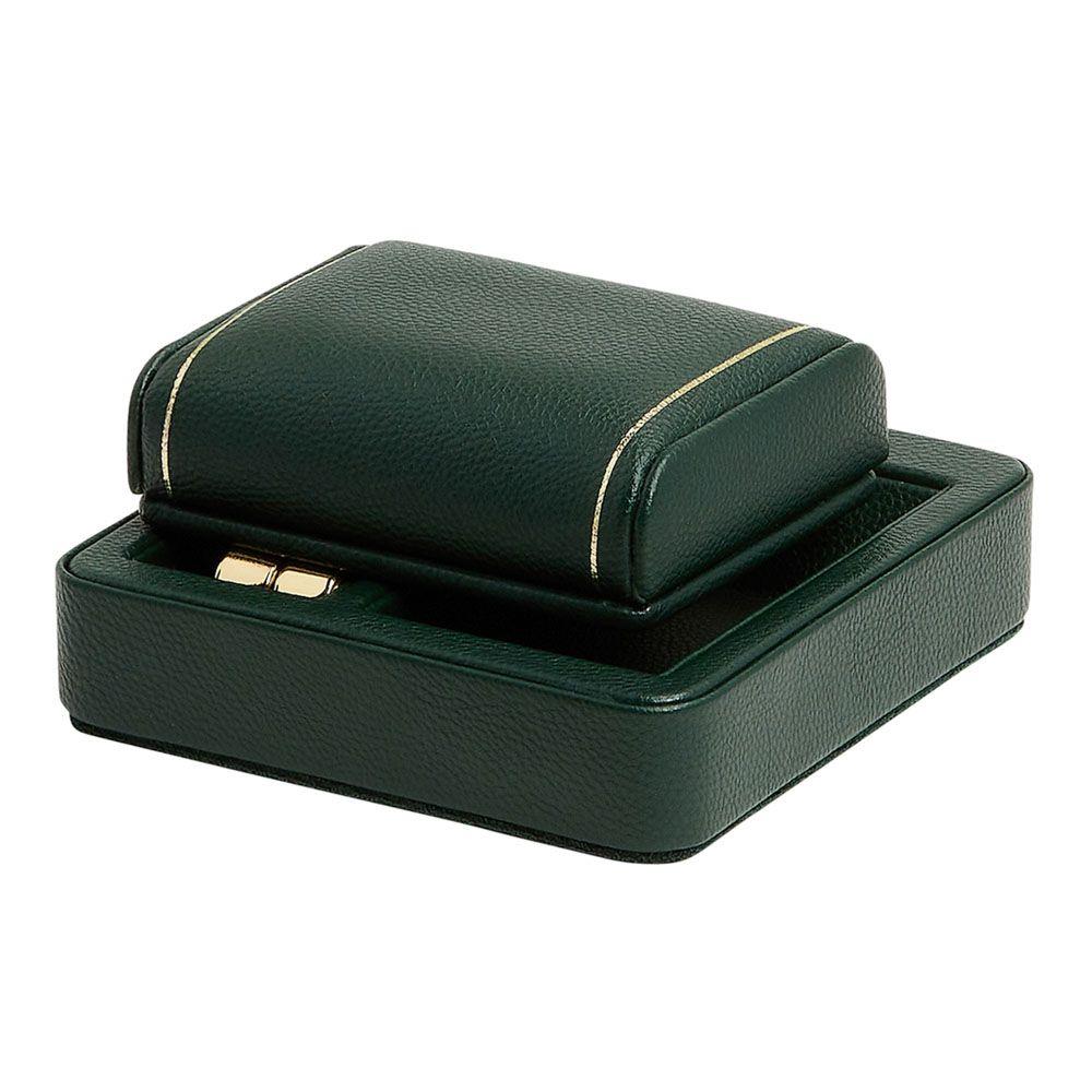 Green leather watch travel stand with hinged lid and gold-toned edging.