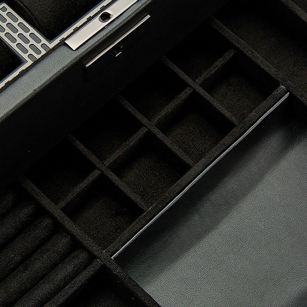Black padded watch compartments with rectangular dividers and slotted inserts