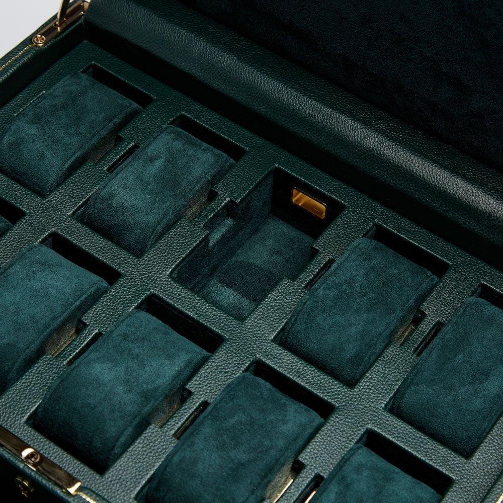 Interior divider tray with multiple watch slots and fitted dark green padding