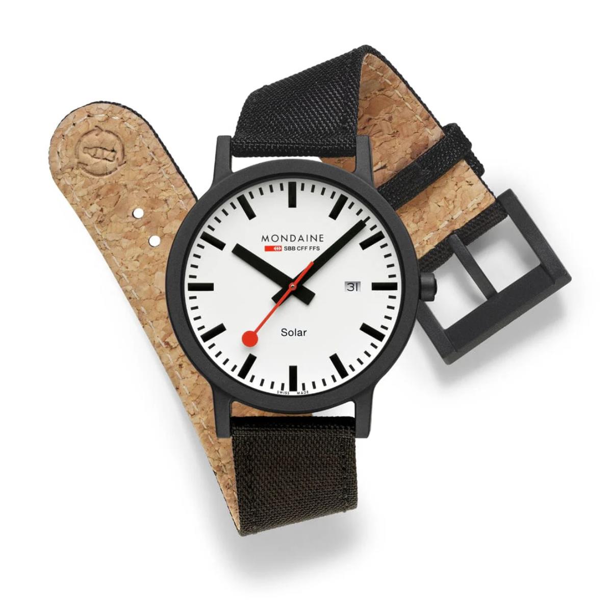 Mondaine Essence MS1.41910.LB eco-friendly watch displayed, showing its cork-lined inner textile strap and black case