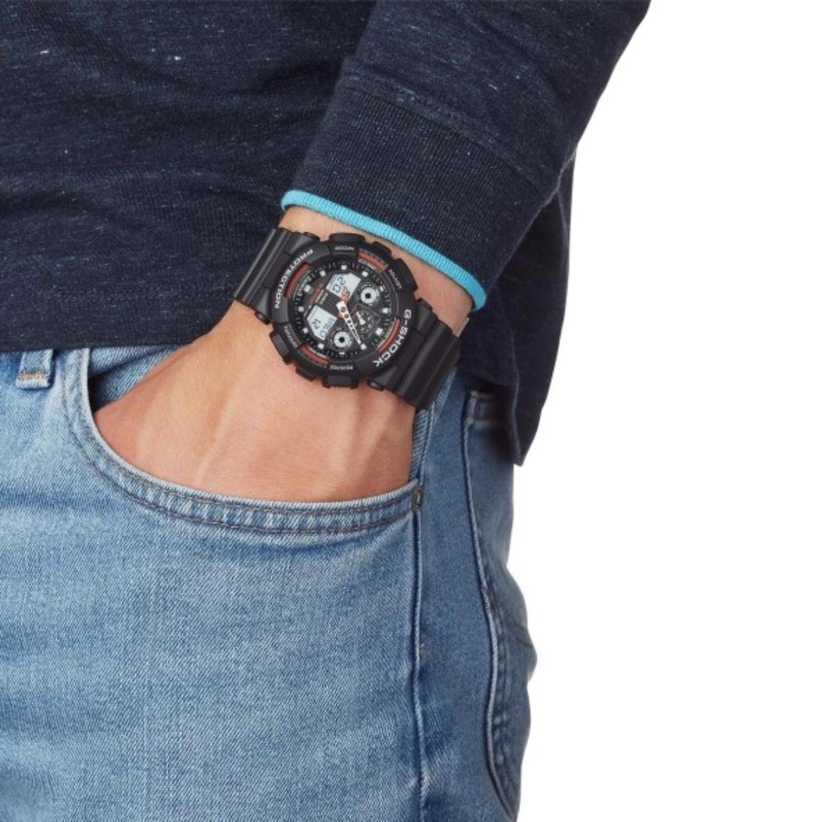 Casio G-Shock GA-100-1A4ER lifestyle shot featuring a black dial display watch worn on the wrist