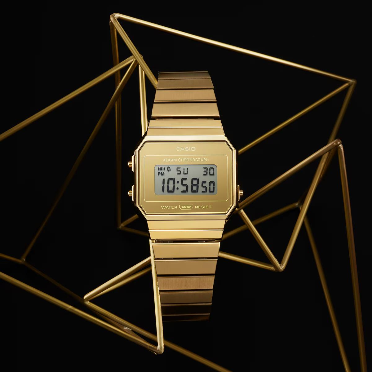 Casio Vintage Iconic A700WEVG-9AEF gold digital steel strap watch on abstract geometric stand