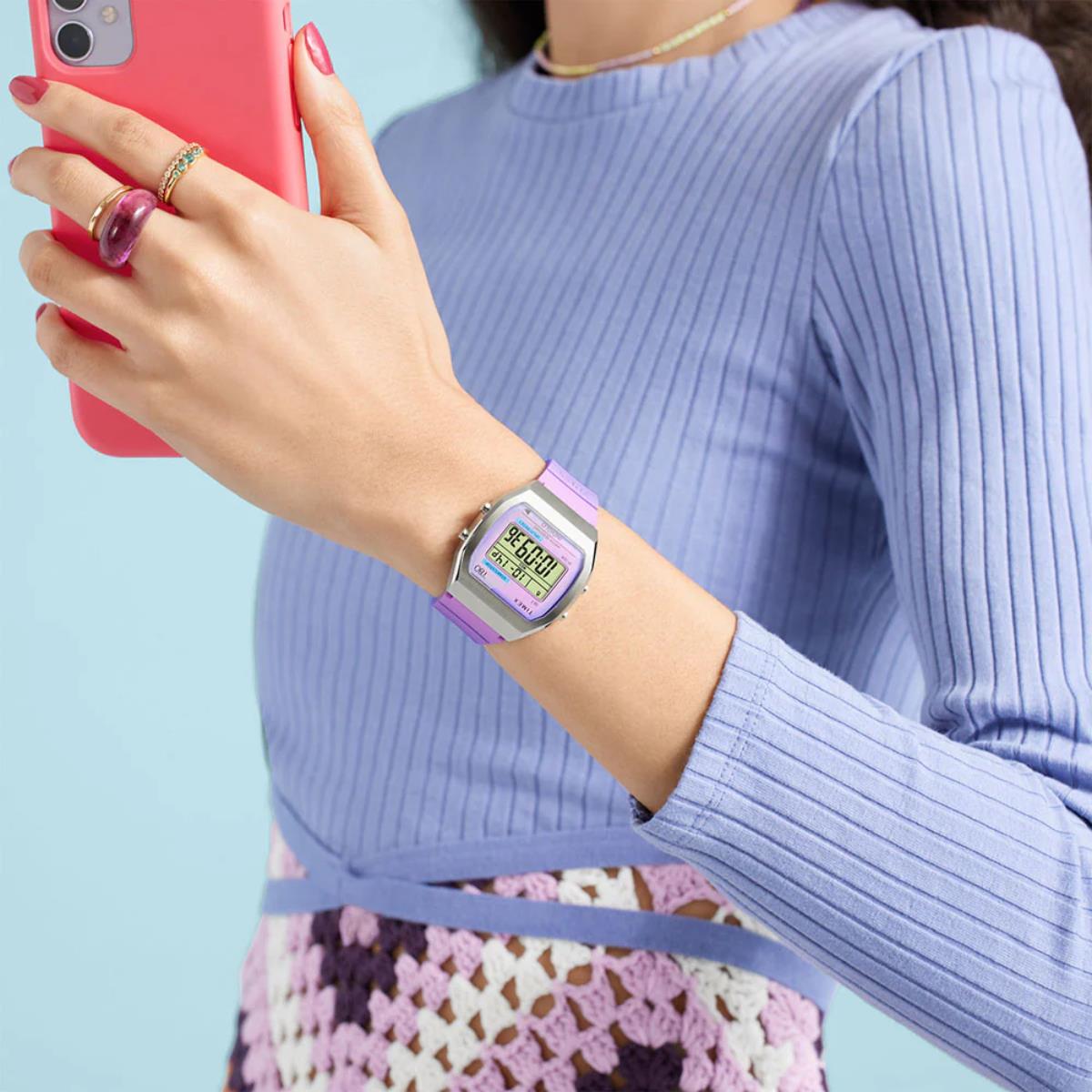 Timex T80 digital watch on wrist with two-tone blue and purple resin strap