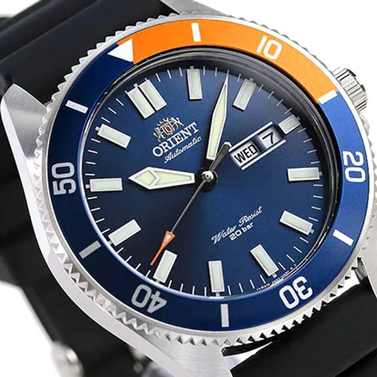 Men's automatic watch with blue dial, black silicone strap, and stainless steel bezel