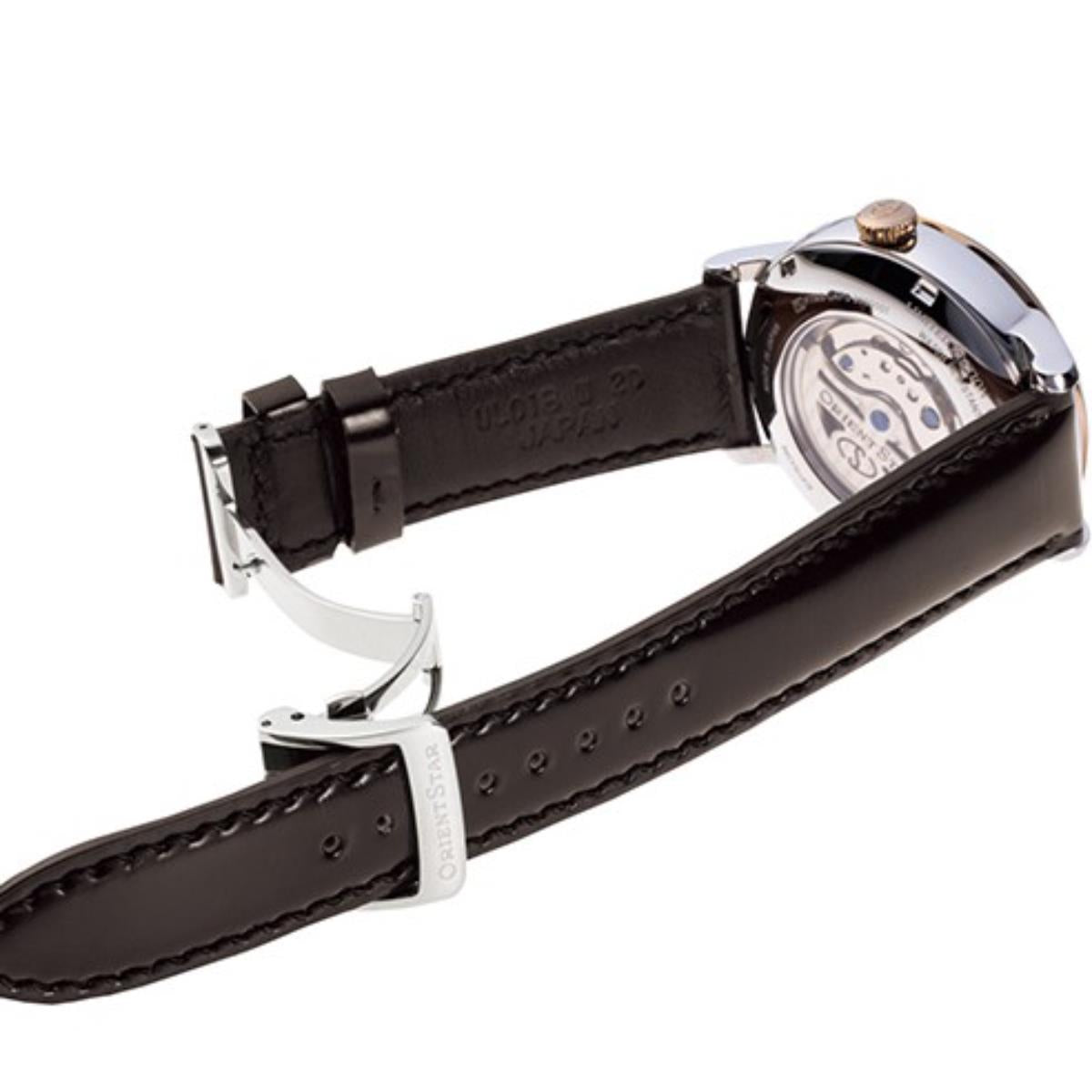 Men's watch with brown leather strap and metal buckle clasp