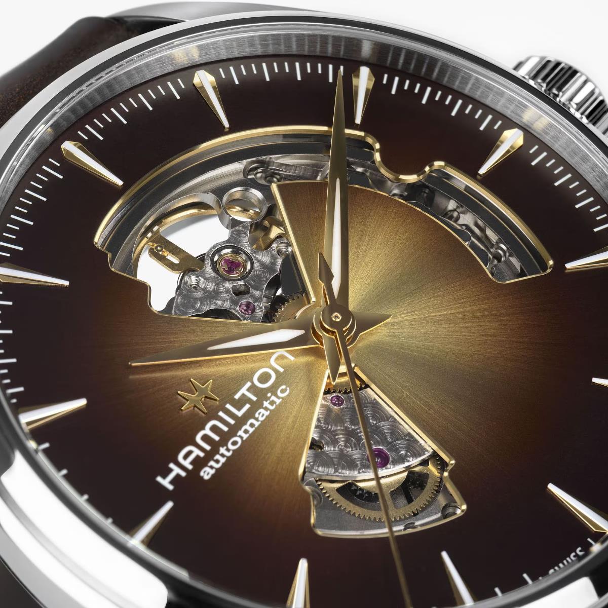Hamilton Jazzmaster H32705501 mens watch macro detail highlighting brown sunburst dial cutout and gold-tone hands