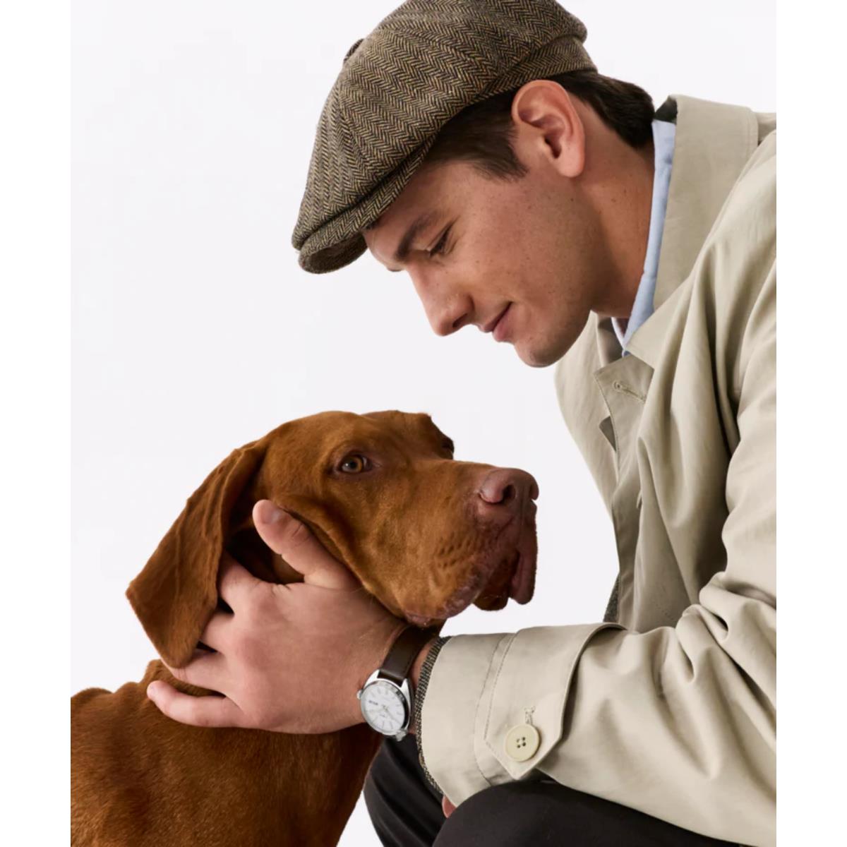 Timex Marlin TW2Y65200 lifestyle shot featuring watch on wrist with a dog
